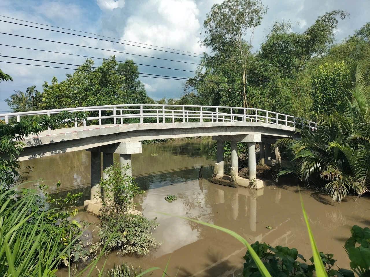 The completed bridge arching over the canal