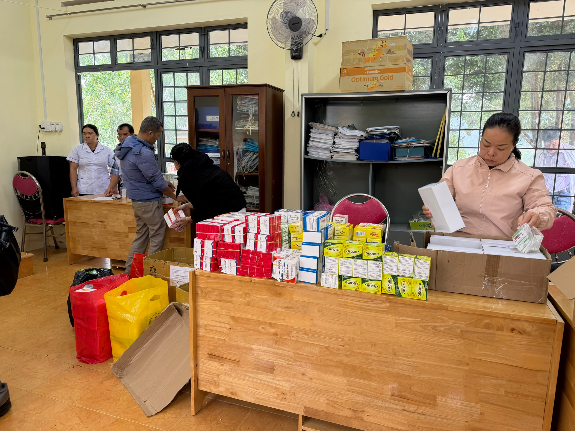 Volunteers and medical staff sorting donated medicines