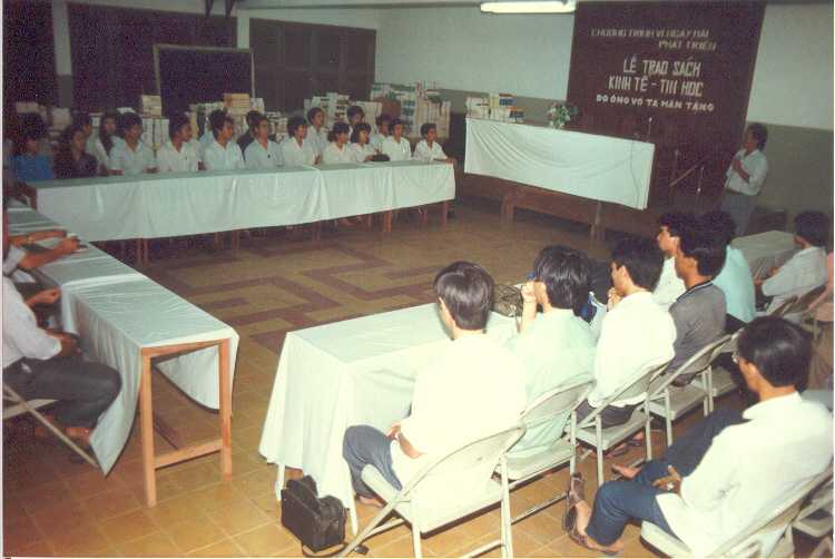 Book donation ceremony for the For a Developed Tomorrow scholarship program, 1990