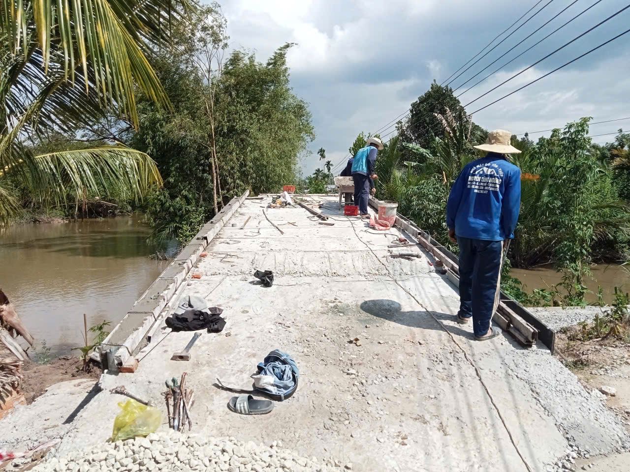 Local workers finishing the concrete deck surface
